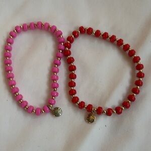 Pink and Red Beaded Stretch Bracelets with Gold Charms stamped JCrew